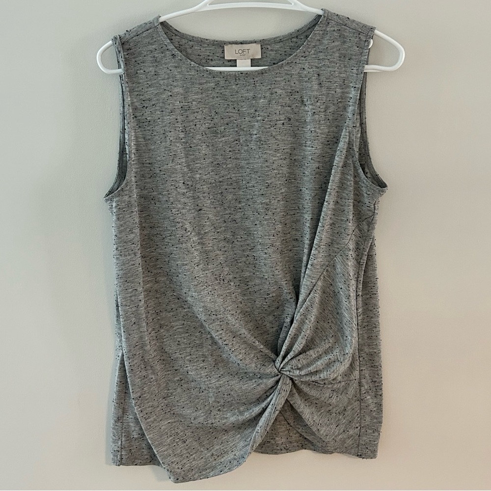 Grey tank with black specks
